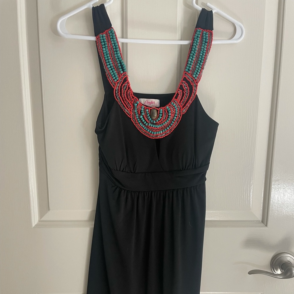 Black dress, medium, fits like a small. Turquoise beading around neck.